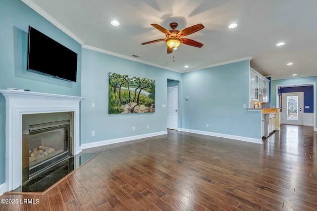 living room featuring ceiling fan, ornamental molding, and dark hardwood / wood-style floors