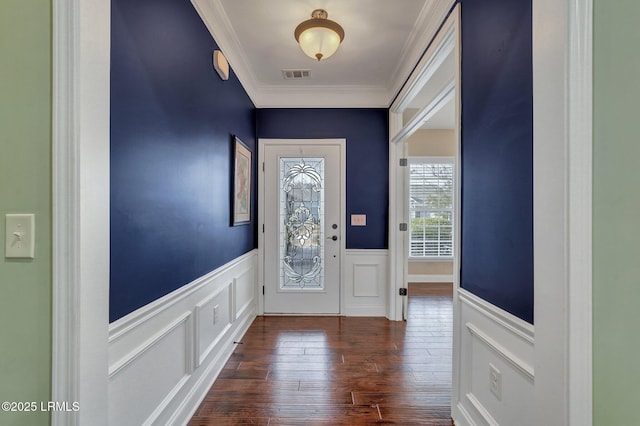 entryway with crown molding and dark wood-type flooring