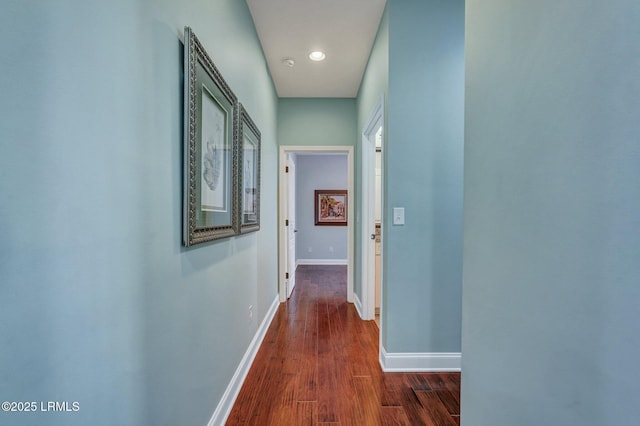 hall with dark hardwood / wood-style floors