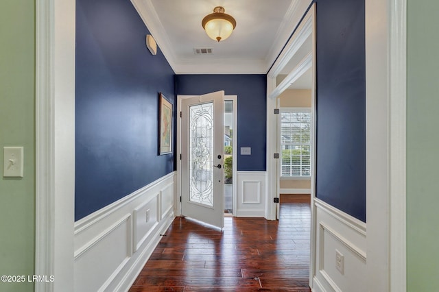 entrance foyer with crown molding and dark hardwood / wood-style floors