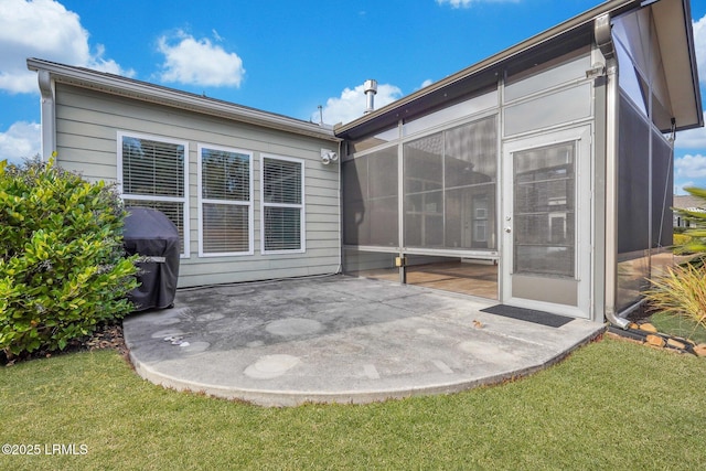 back of house featuring a yard and a patio area