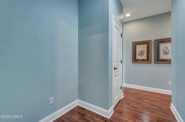 hallway featuring dark hardwood / wood-style floors