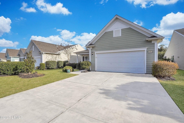 view of front of property with a garage and a front lawn