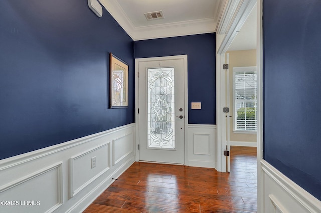 entrance foyer with dark wood-type flooring and ornamental molding