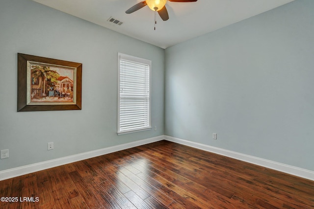 unfurnished room with ceiling fan and dark hardwood / wood-style floors