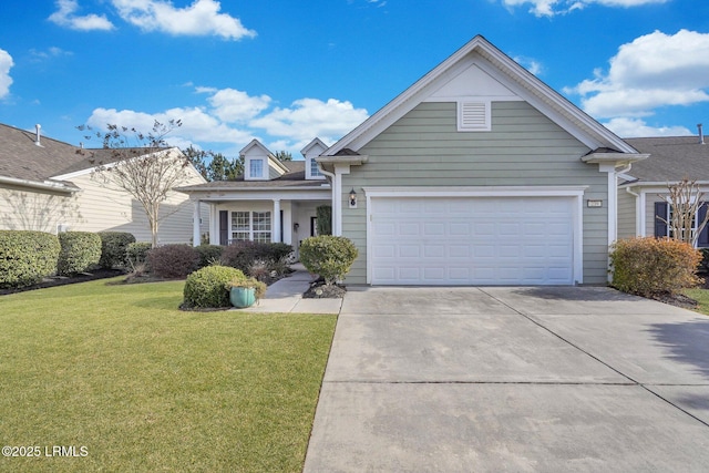 view of front of property with a garage and a front lawn