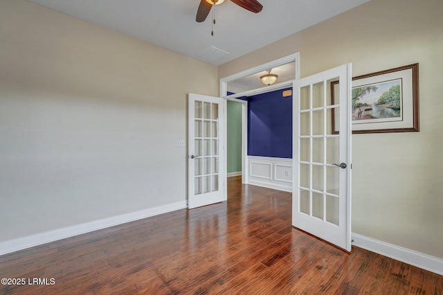 empty room with dark wood-type flooring, french doors, and ceiling fan