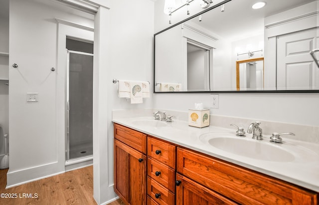 22 Harford Unit B, Beaufort, SC 29906 - full bathroom featuring wood finished floors, a stall shower, and double vanity
