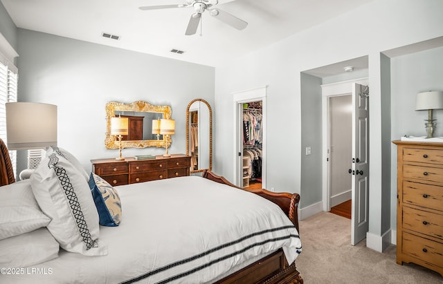 22 Harford Unit B, Beaufort, SC 29906 - bedroom with a spacious closet, light colored carpet, a closet, and a ceiling fan