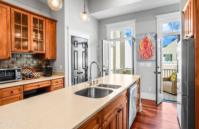 22 Harford Unit B, Beaufort, SC 29906 - kitchen with appliances with stainless steel finishes, brown cabinetry, dark wood-style flooring, and light countertops