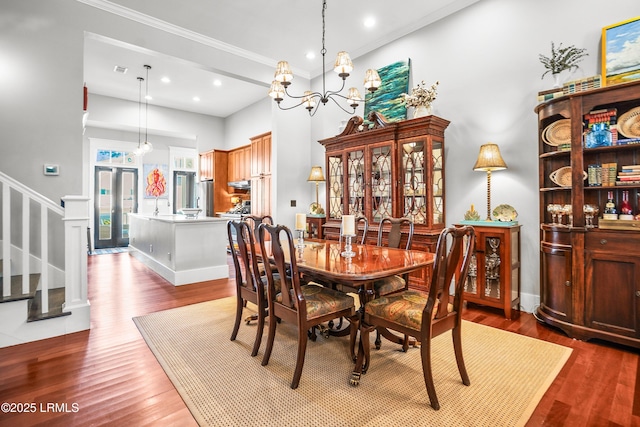 22 Harford Unit B, Beaufort, SC 29906 - dining space featuring stairway, wood finished floors, a chandelier, ornamental molding, and recessed lighting