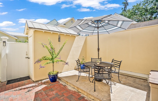 22 Harford Unit B, Beaufort, SC 29906 - view of patio / terrace featuring outdoor dining area and an outbuilding