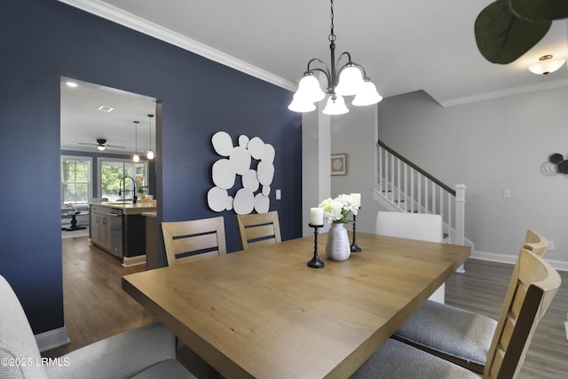 587 Hulston Landing Rd, Bluffton, SC 29909 - dining area with a chandelier, dark wood-style floors, ornamental molding, stairway, and a ceiling fan