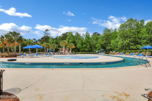 587 Hulston Landing Rd, Bluffton, SC 29909 - community pool with a patio area and view of scattered trees