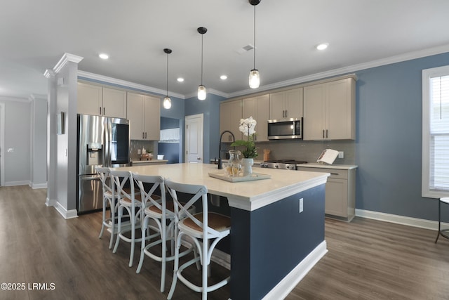 587 Hulston Landing Rd, Bluffton, SC 29909 - kitchen with appliances with stainless steel finishes, tasteful backsplash, an island with sink, crown molding, and dark wood-style flooring