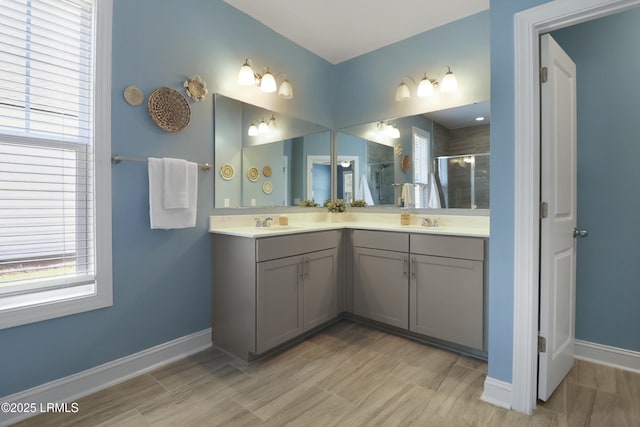 587 Hulston Landing Rd, Bluffton, SC 29909 - bathroom featuring a shower stall, double vanity, and healthy amount of natural light
