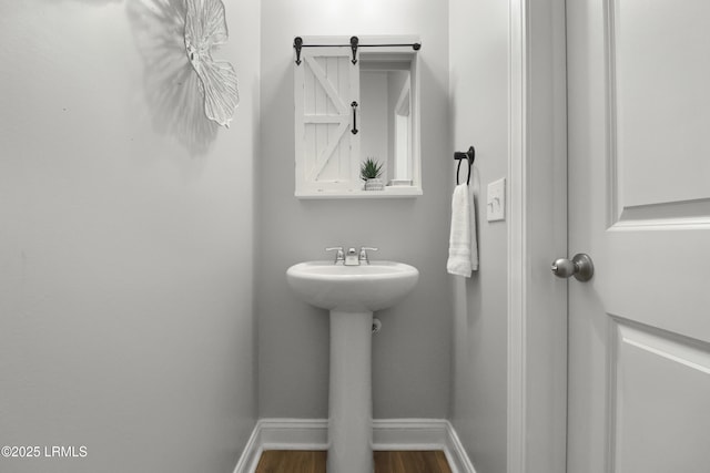 587 Hulston Landing Rd, Bluffton, SC 29909 - bathroom with baseboards and wood finished floors