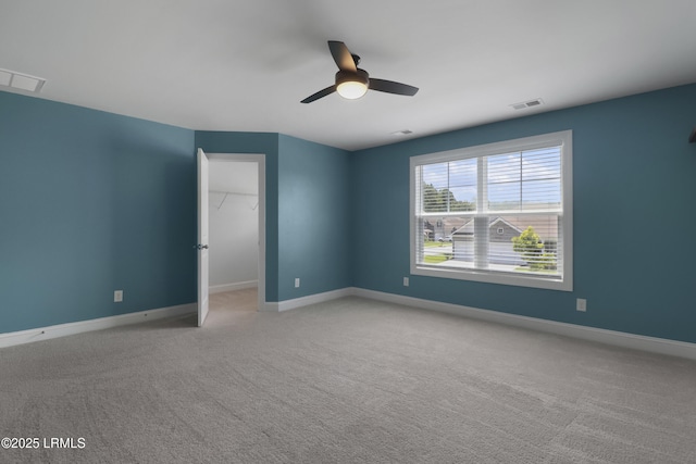 587 Hulston Landing Rd, Bluffton, SC 29909 - unfurnished bedroom with carpet flooring, a spacious closet, ceiling fan, and a closet