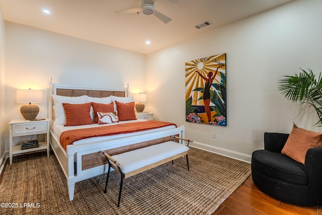 bedroom with visible vents, recessed lighting, baseboards, and wood finished floors