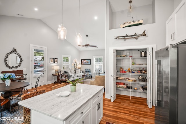 1 William St, Beaufort, SC 29907 - kitchen with freestanding refrigerator, white cabinets, a ceiling fan, and wood finished floors