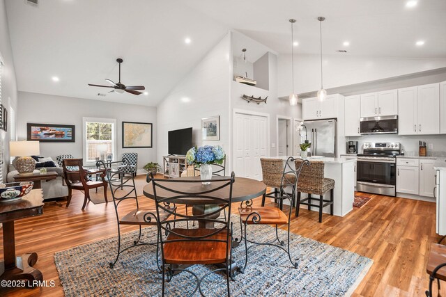 1 William St, Beaufort, SC 29907 - dining room with a ceiling fan, recessed lighting, light wood finished floors, and high vaulted ceiling