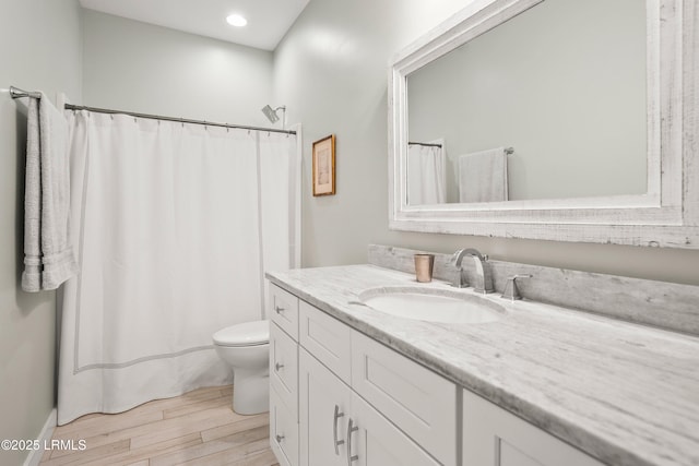 1 William St, Beaufort, SC 29907 - full bathroom featuring toilet, vanity, recessed lighting, and wood finished floors