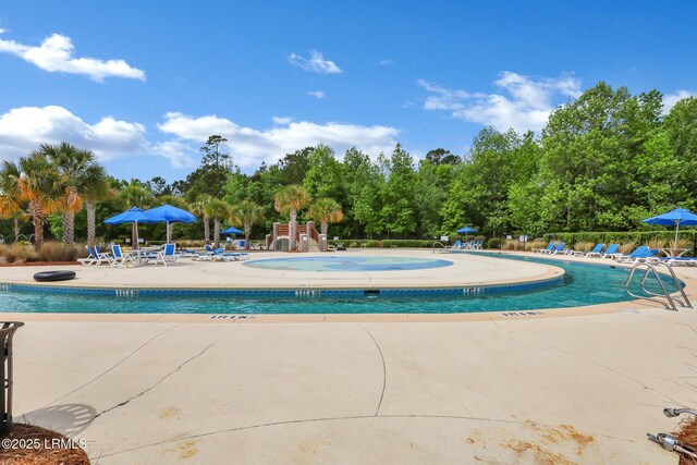 pool with a patio