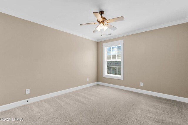 spare room featuring baseboards, crown molding, light carpet, and ceiling fan
