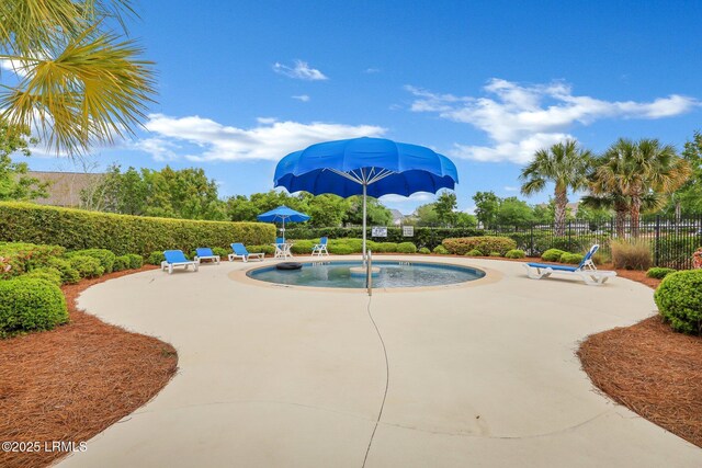 pool featuring a patio area and fence