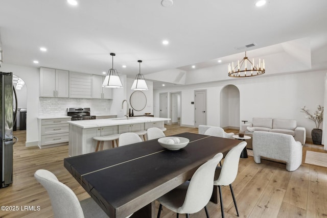 72 Cypress Marsh Dr, Hilton Head Island, SC 29926 - dining area with recessed lighting, baseboards, light wood-style floors, and a chandelier