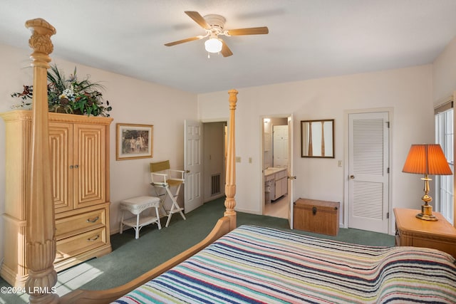 carpeted bedroom with a closet, ceiling fan, and ensuite bathroom