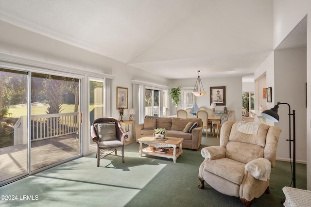 living room with vaulted ceiling and carpet flooring