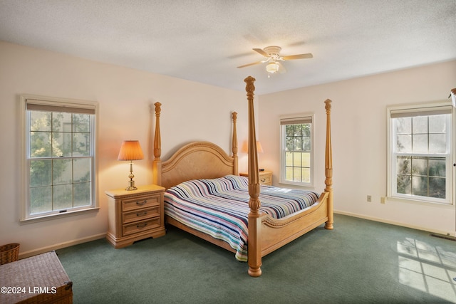 carpeted bedroom featuring a textured ceiling and ceiling fan