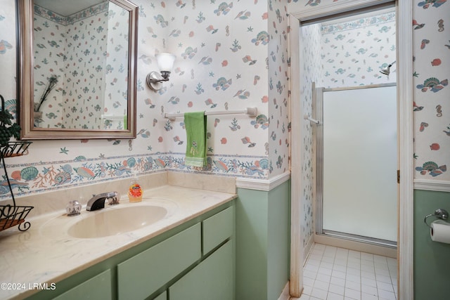 bathroom featuring an enclosed shower, vanity, and tile patterned floors