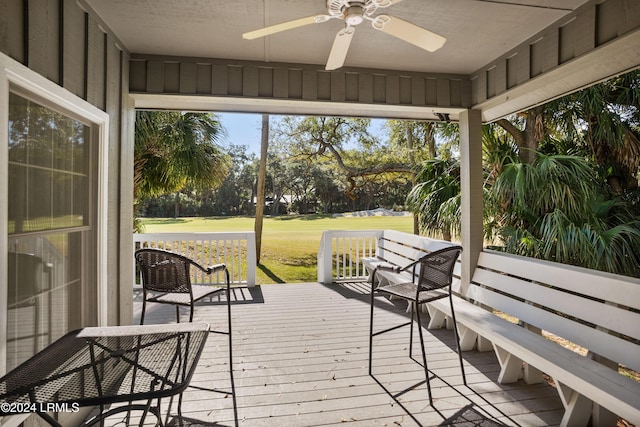 sunroom / solarium with ceiling fan