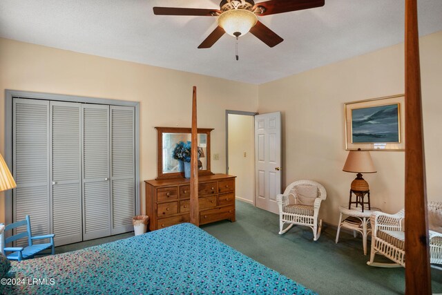 carpeted bedroom featuring a closet and ceiling fan