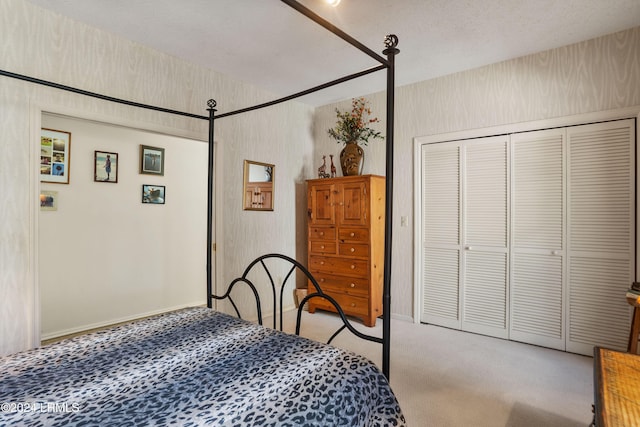 carpeted bedroom featuring a closet