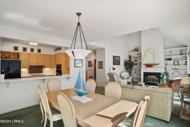 dining space featuring carpet