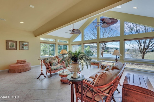 sunroom / solarium featuring vaulted ceiling with beams and ceiling fan