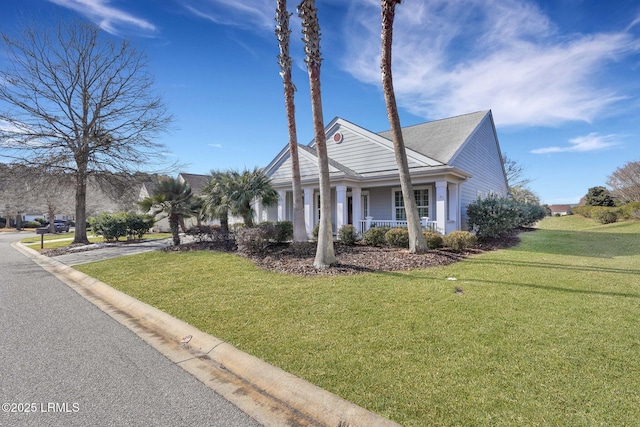 view of front of property with a front yard and a porch