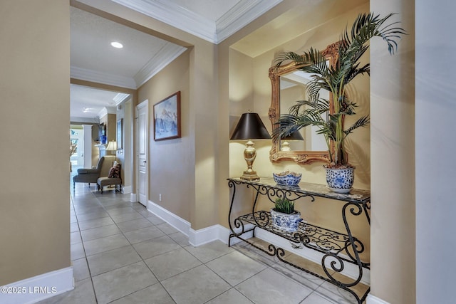 hallway featuring crown molding and light tile patterned floors