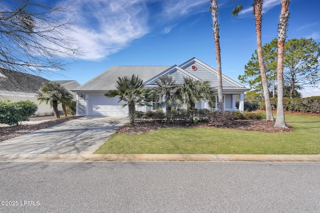 view of front of property with a garage and a front yard