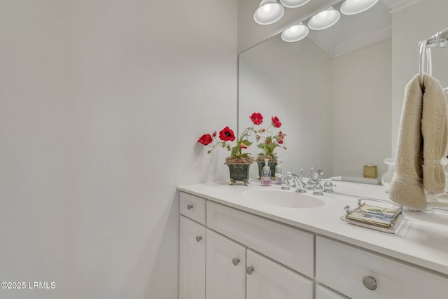 bathroom with vanity and crown molding