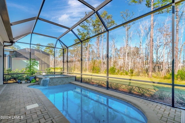 view of pool featuring an in ground hot tub, a lanai, and a patio