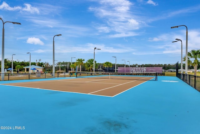 view of sport court featuring basketball hoop