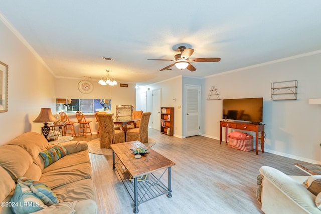 living room featuring ceiling fan with notable chandelier, light hardwood / wood-style flooring, and ornamental molding