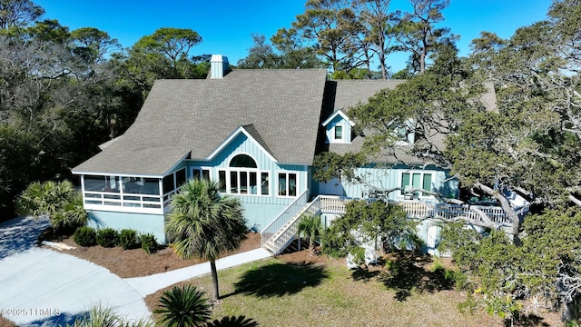 view of front of house with a sunroom