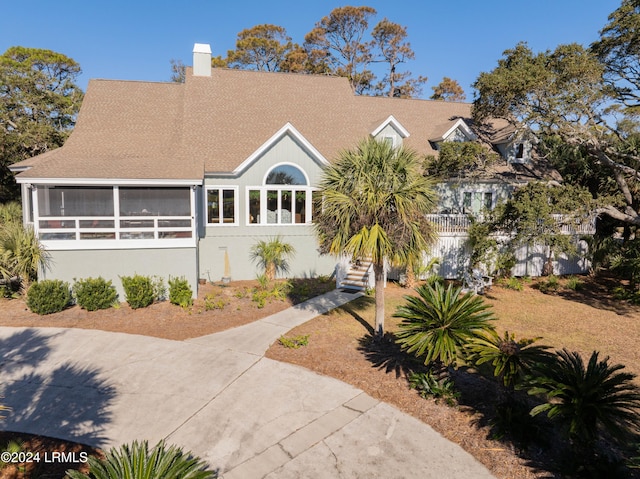 view of front of house featuring a sunroom