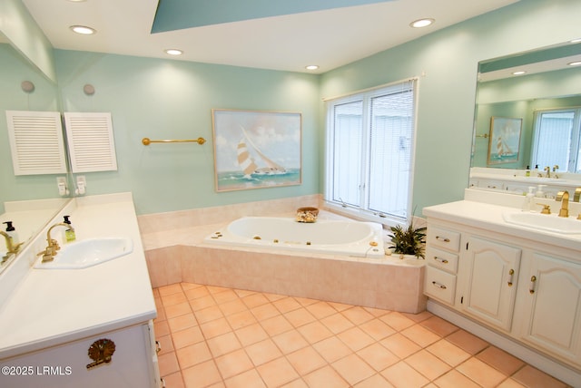 101 Ocean Point Dr, Fripp Island, SC 29920 - bathroom featuring a tub with jets, tile patterned floors, two vanities, recessed lighting, and a skylight