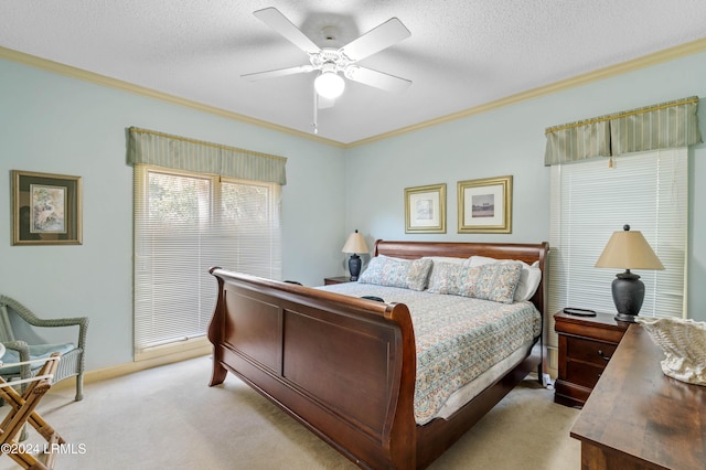 carpeted bedroom featuring ornamental molding and a textured ceiling